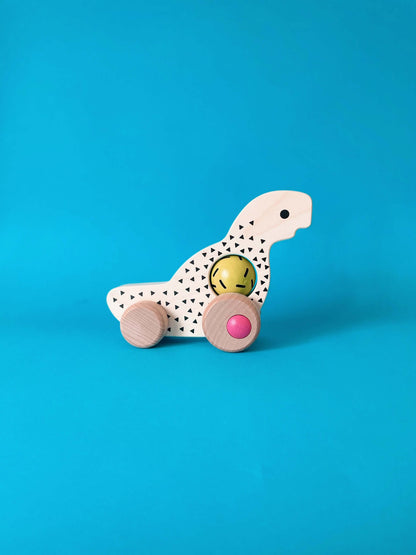 Дървена детска играчка Динозавър с колелца - BAJO