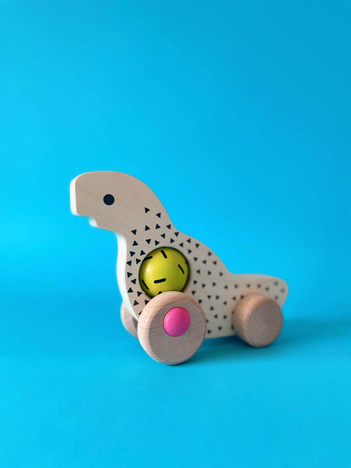 Дървена детска играчка Динозавър с колелца - BAJO