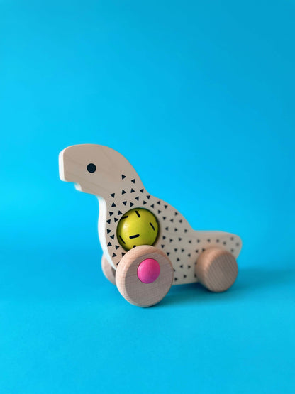 Дървена детска играчка Динозавър с колелца - BAJO